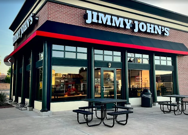 Black and red commercial storefront canopy installed above a Jimmy John's restaurant entrance